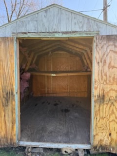 Empty backyard shed after cleanout