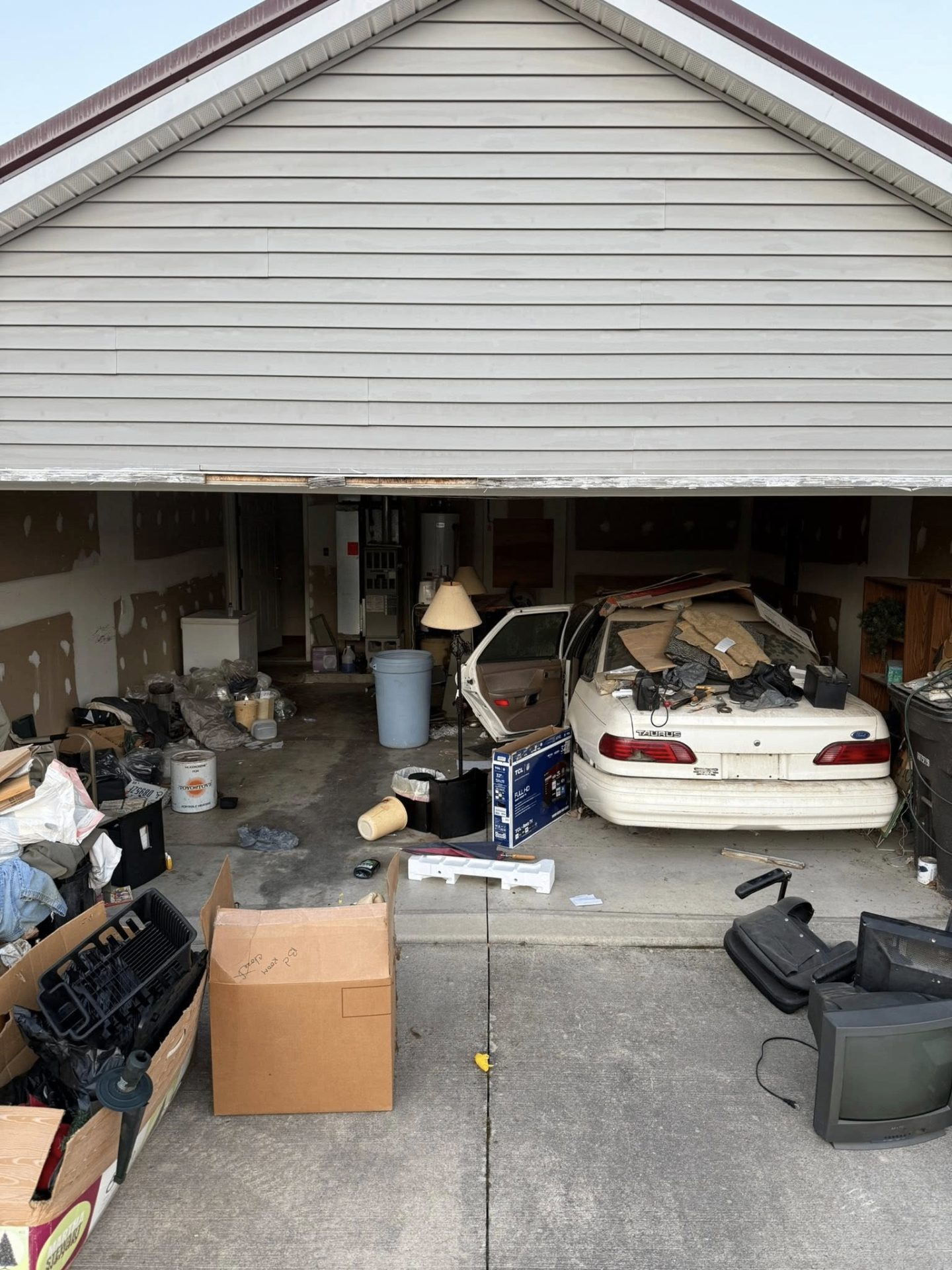 Garage clutter before cleanout