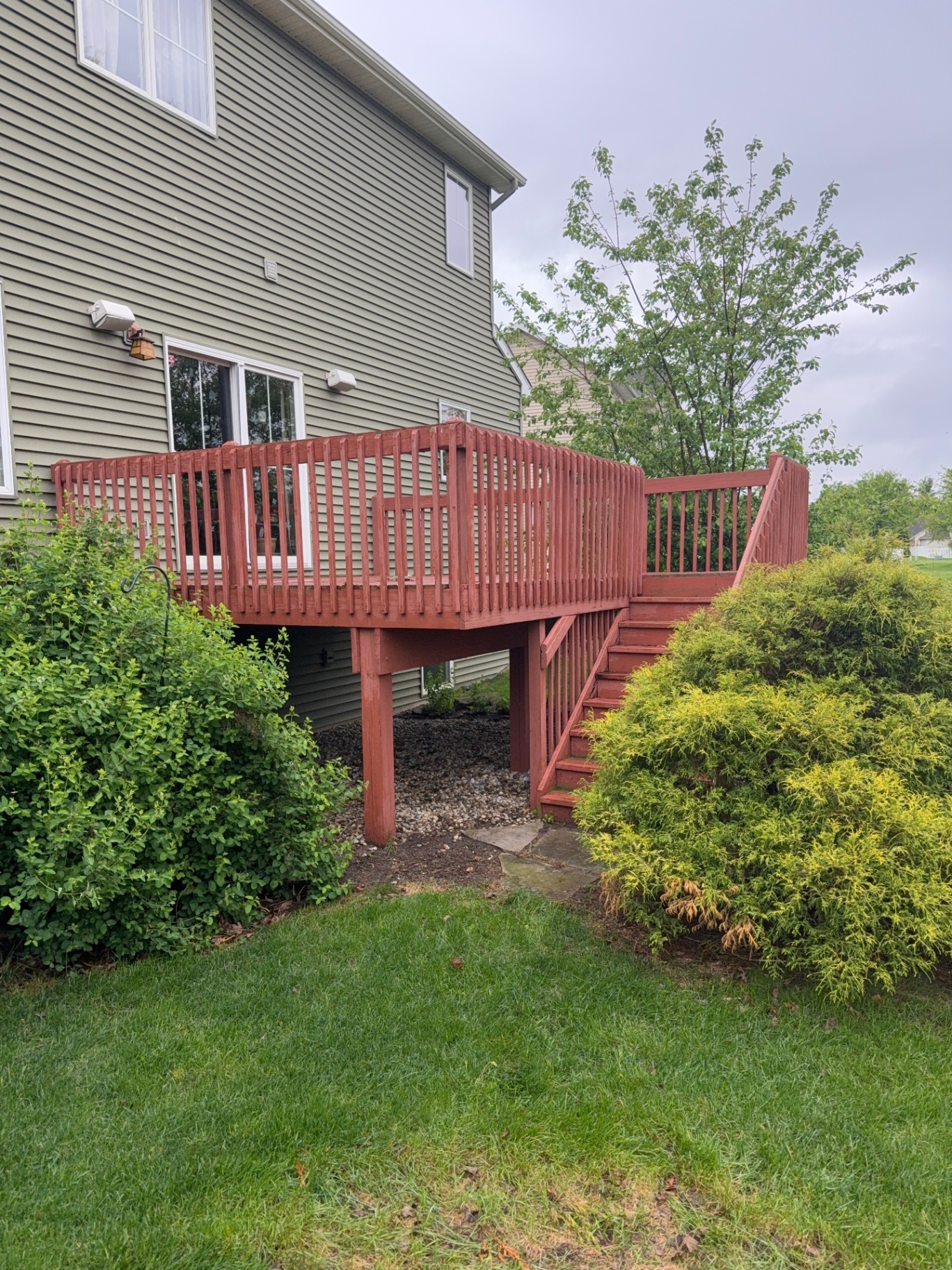 Old red wooden deck before demolition
